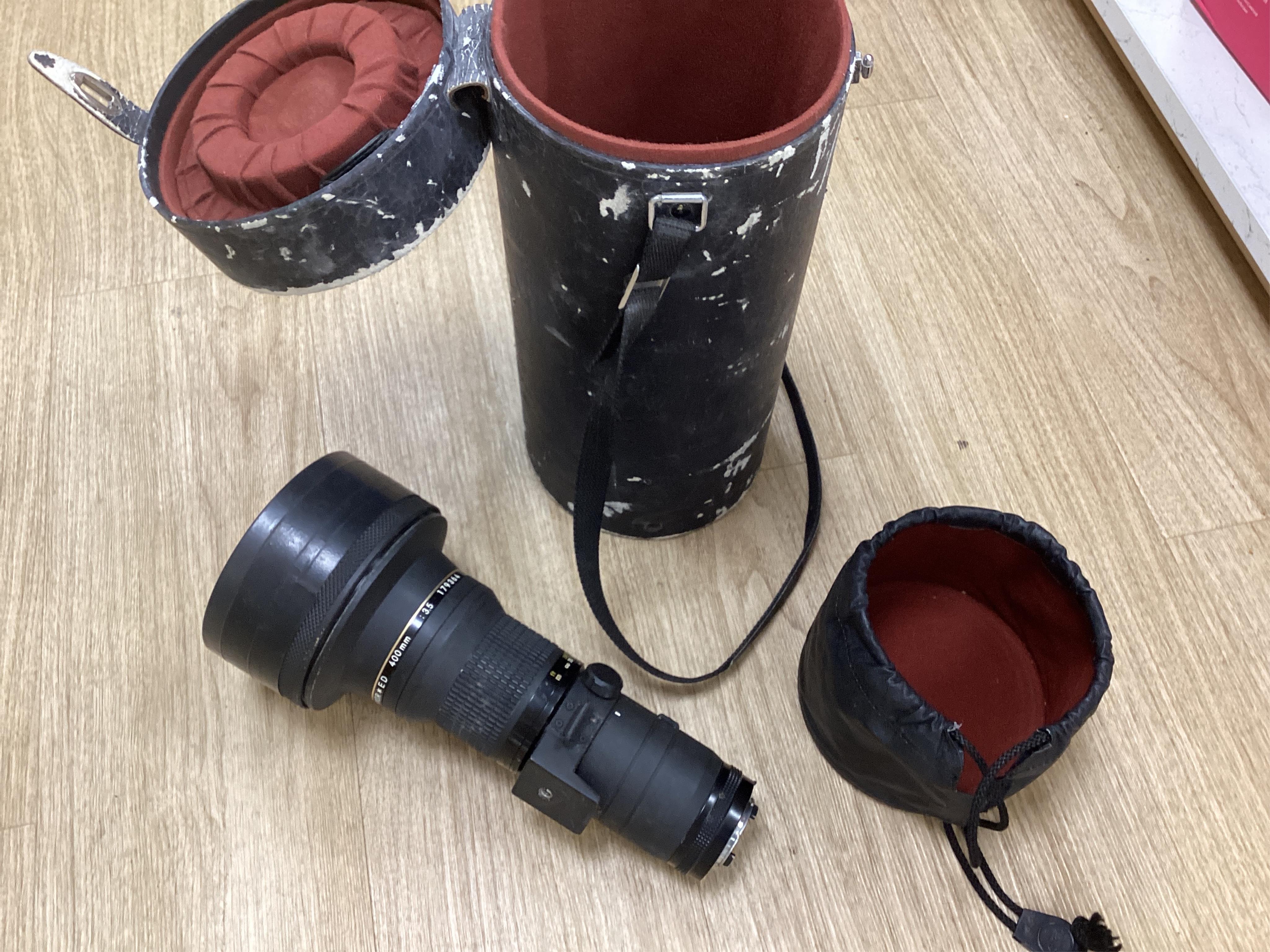 A collection of camera equipment to include a Nikon 'Nikkor' ED 400mm 1:35 179364 lens, cameras etc. in a Billingham camera bag. Condition - general wear commensurate with use